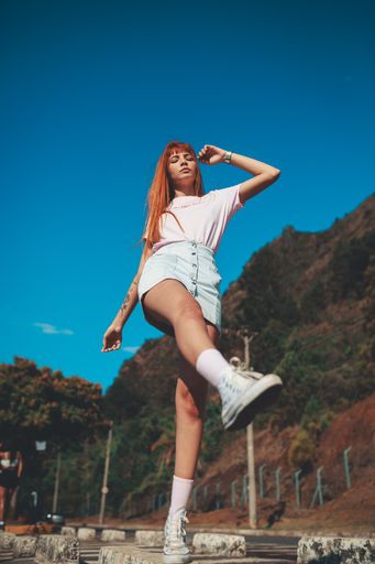 Outdoor portrait of young sexy woman posing on street. Stock Photo by  ©NataliaGrabovskaya 141456230